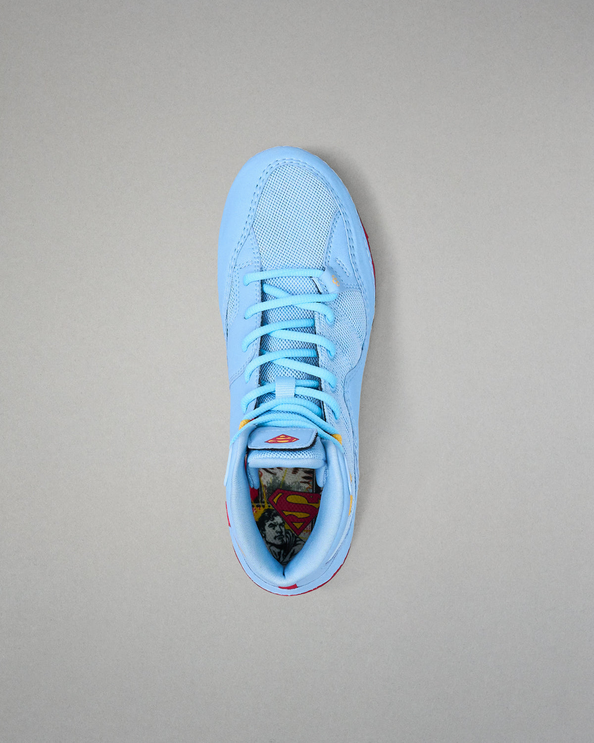 Top view of RUDIS JB1 Superman wrestling shoe showing light blue laces, mesh upper and Superman graphic footbed.