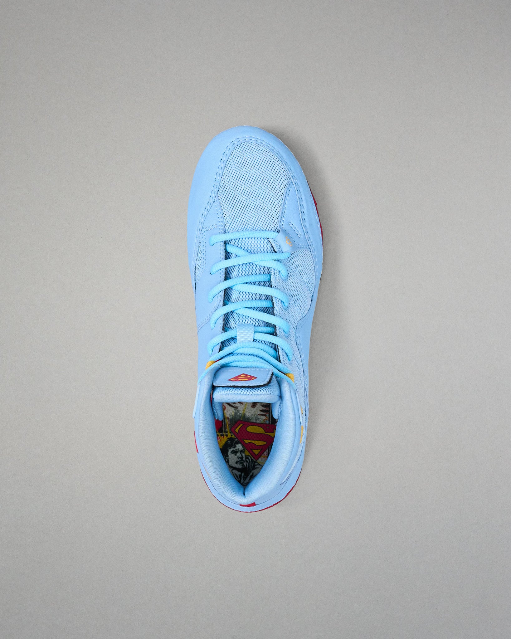 Top view of RUDIS JB1 Superman wrestling shoe showing light blue laces, mesh upper and Superman graphic footbed.