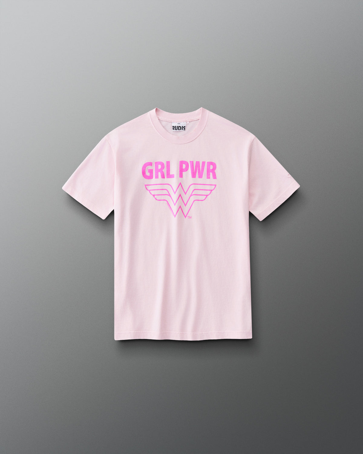 Front view of RUDIS Wonder Woman Girl Power Youth Relaxed Cotton T-Shirt in washed pink, featuring a vibrant pink GRL PWR graphic, Wonder Woman emblem, crew neckline and short sleeves.