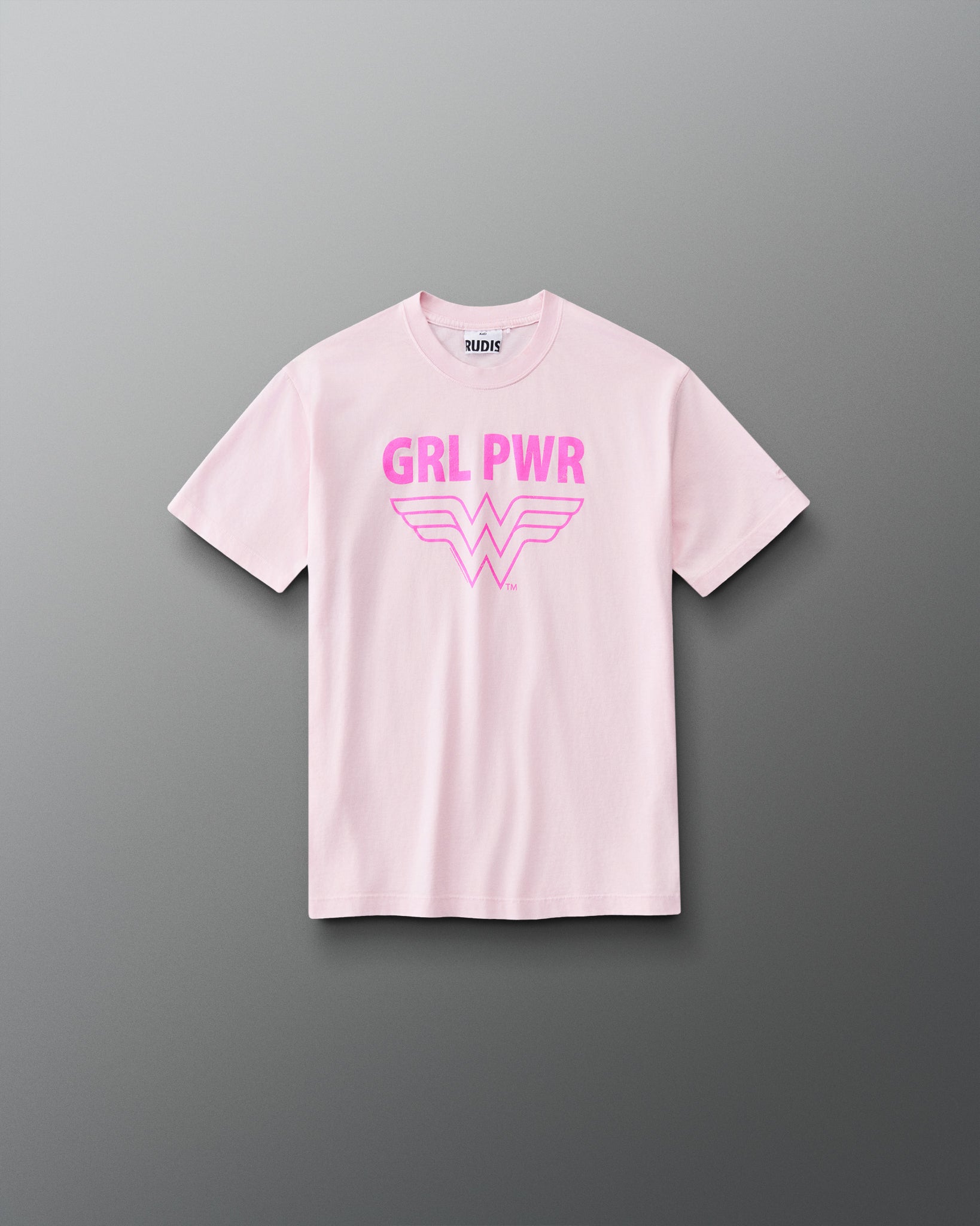 Front view of RUDIS Wonder Woman Girl Power Youth Relaxed Cotton T-Shirt in washed pink, featuring a vibrant pink GRL PWR graphic, Wonder Woman emblem, crew neckline and short sleeves.