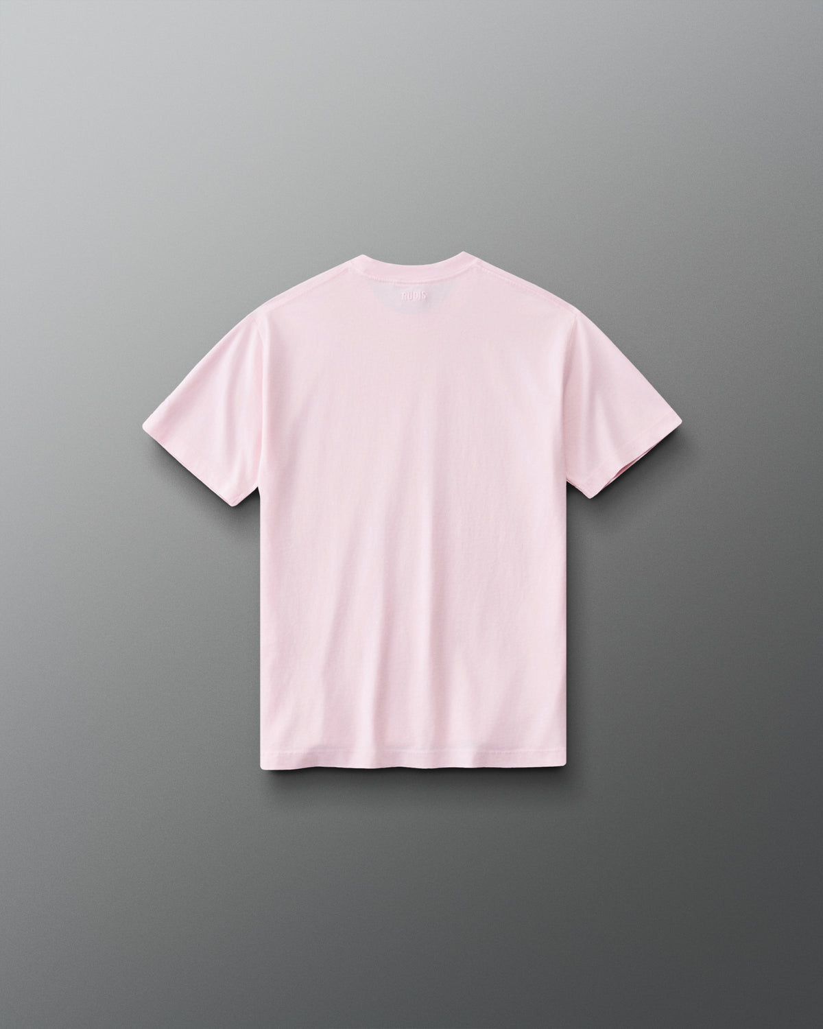 Back view of RUDIS Wonder Woman Girl Power Youth Relaxed Cotton T-Shirt in washed pink, showcasing a clean back design, subtle RUDIS branding below the collar and relaxed short-sleeve silhouette.