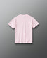 Back view of RUDIS Wonder Woman Girl Power Youth Relaxed Cotton T-Shirt in washed pink, showcasing a clean back design, subtle RUDIS branding below the collar and relaxed short-sleeve silhouette.